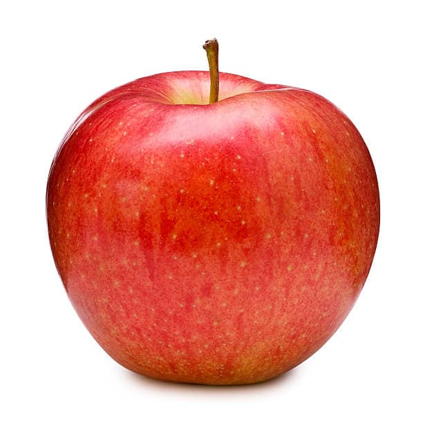 Glossy red organic apples stacked in a wooden crate, handpicked and fresh from sustainable orchards.