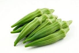 Fresh, organically grown okra (bhindi) arranged neatly on a farm basket—clean, green, and free from pesticides, ideal for healthy everyday cooking.
