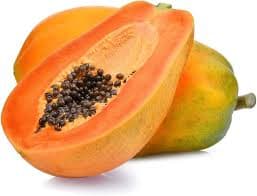 Halved papaya with vibrant orange pulp and seeds placed on a wooden plate for tropical appeal.