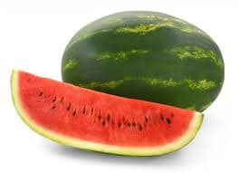 Sliced organic watermelon showing red pulp and black seeds, set on a white platter.