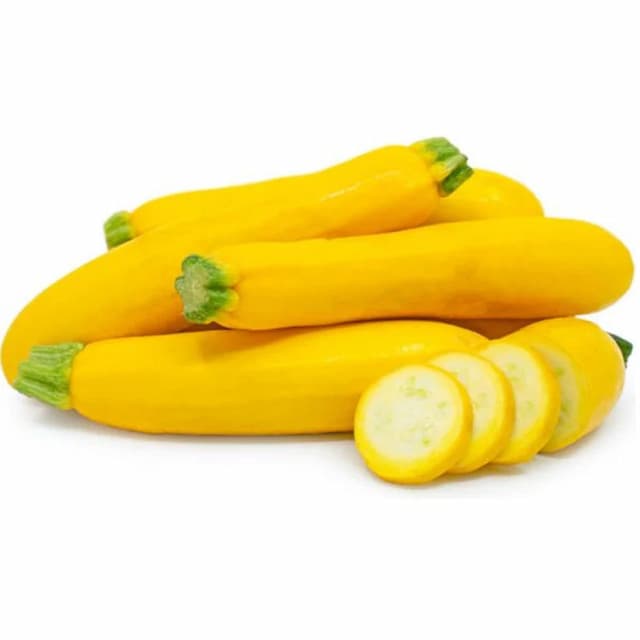 Organic yellow zucchini sliced and whole, laid on a marble surface—freshly picked exotic vegetable with rich color and gourmet appeal.